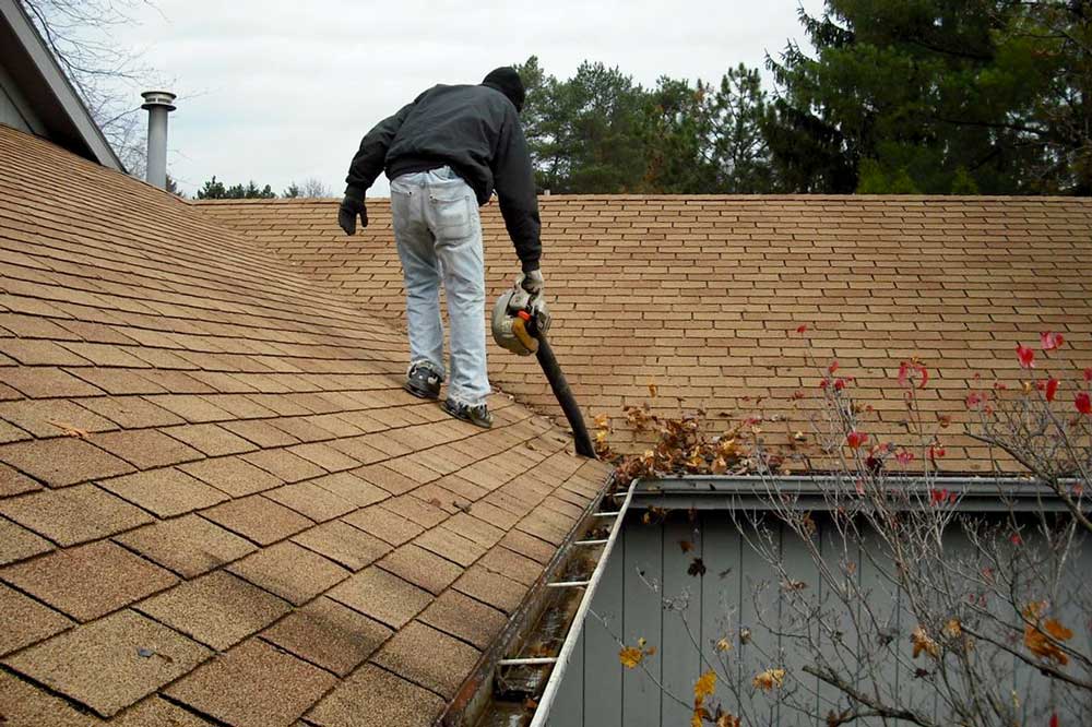 jims-mowing-gutter-cleaning-services-man-on-the-roof Jim's Mowing gutter cleaning