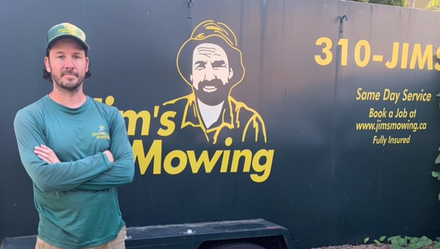 Adam Wood our Jim’s Mowing franchisee in Maple Ridge in front of trailer Adam Wood our Jim’s Mowing franchisee in Maple Ridge in front of trailer