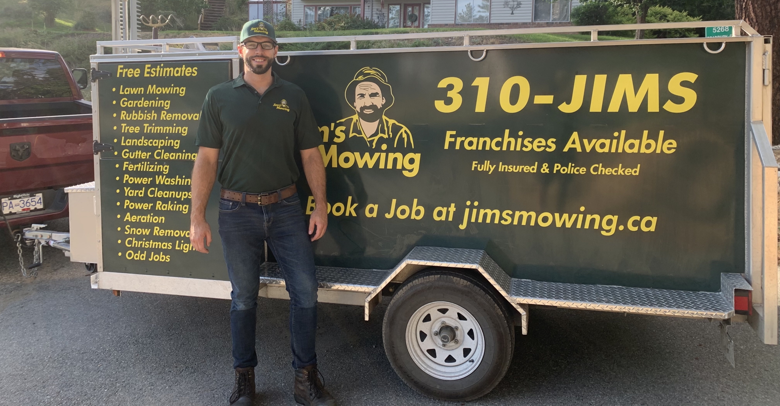 Daniel Black our Jim’s Mowing franchisee in Downtown Kelowna and West Kelowna in front of trailer Daniel Black our Jim’s Mowing franchisee in Downtown Kelowna and West Kelowna in front of trailer