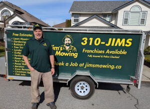 roger-hinz-in-front-of-trailer-jims-mowing